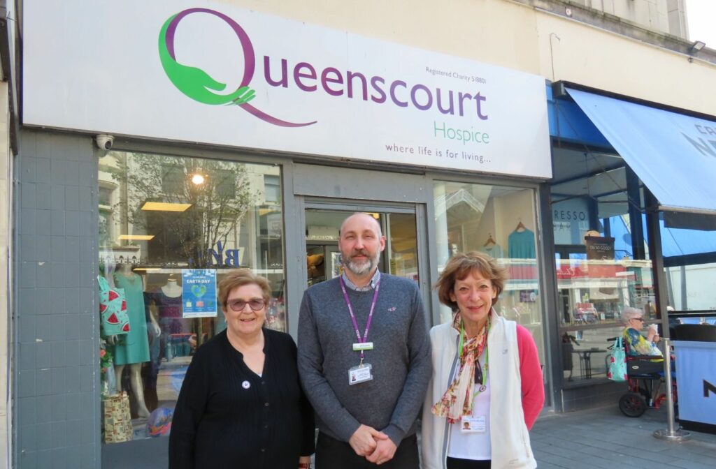 Dave Lavery Manager of the Queenscourt Hospice Shop on Chapel Street in Southport town centre along with Queenscourt volunteers Sandra Wood and Linda Dalle Mulle. Photo by Andrew Brown Stand Up For Southport