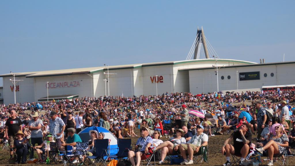 Crowds at Southport Air Show with Ocean Plaza Leisure in the background.