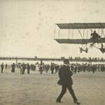 An early aircraft wwows crowds above Southport Beach as spectators line Southport Pier. Photo courtesy of The Atkinson in Southport