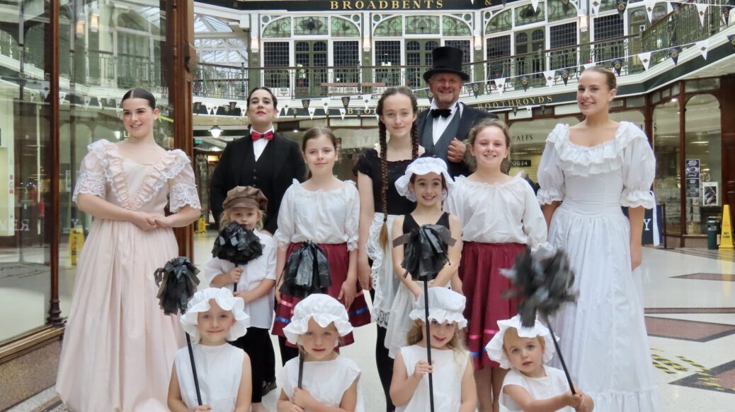 People are being invited to enjoy a very special Victorian Weekend as the historic Wayfarers Shopping Arcade in Southport celebrates its 125th anniversary.Master of Ceremonies Jordan Plunkett and Vesta Tilley with children from the Alison Wright School of Dance and Drama. Photo by Andrew Brown Stand Up For Southport
