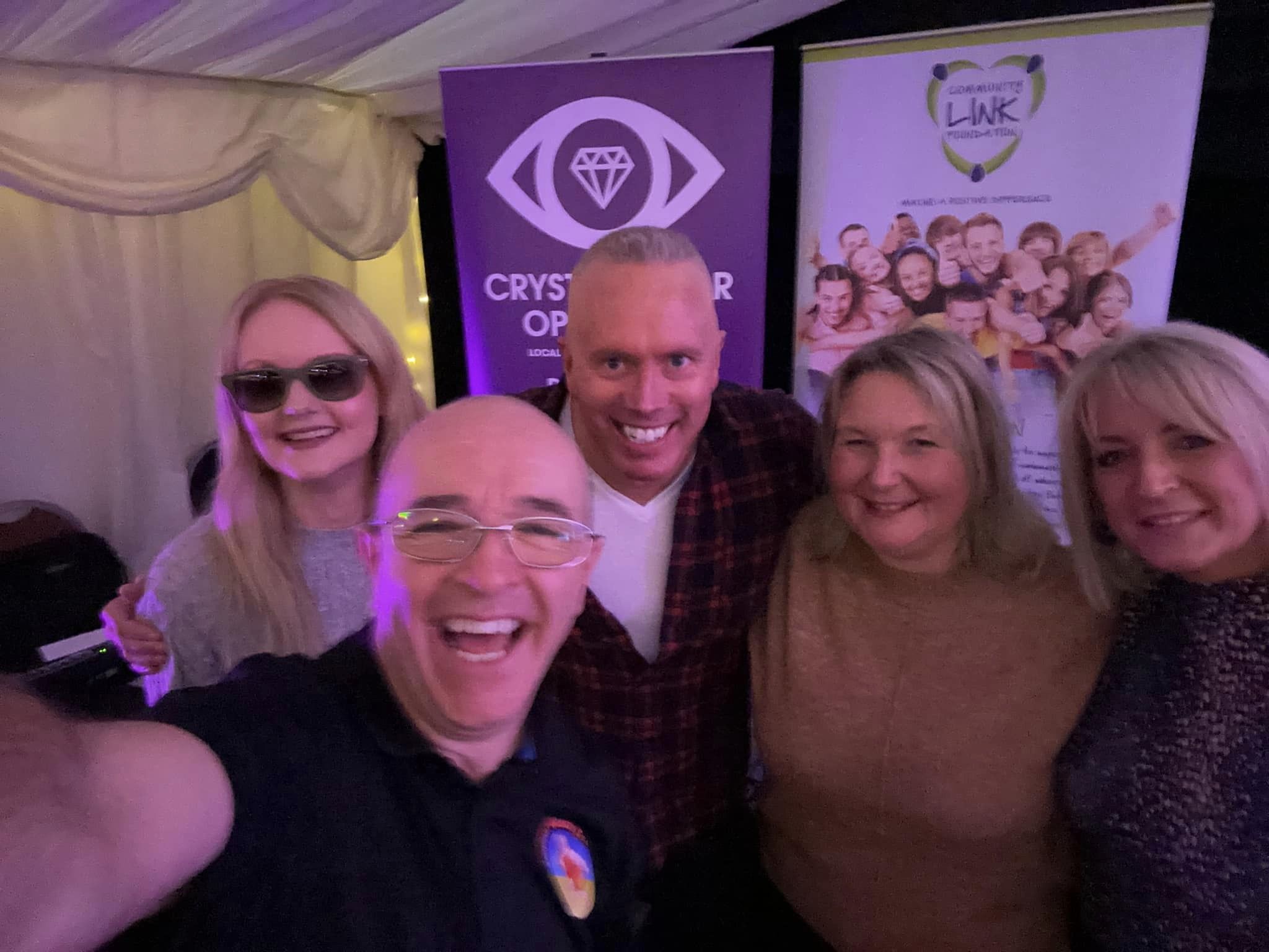 People enjoy a Comedy Bingo night raising funds for the Community Link Foundation charity at Southport Comedy Festival. Compere Brendan Riley with the team from Crystal Clear Opticians