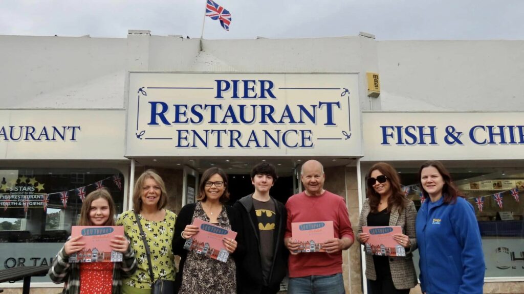 Ruth Spillane held a book launch for 'Southport Illustrated' at Silcock's Pier Family Restaurant in Southport. Ruth (third left) is pictured with members of her family and with Silcock Leisure Group Operations Manager Serena Silcock-Prince (second right) and Sorcha O'Brien from Dune Radio (right). Photo by Andrew Brown Stand Up For Southport