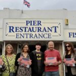 Ruth Spillane held a book launch for 'Southport Illustrated' at Silcock's Pier Family Restaurant in Southport. Ruth (third left) is pictured with members of her family and with Silcock Leisure Group Operations Manager Serena Silcock-Prince (second right) and Sorcha O'Brien from Dune Radio (right). Photo by Andrew Brown Stand Up For Southport