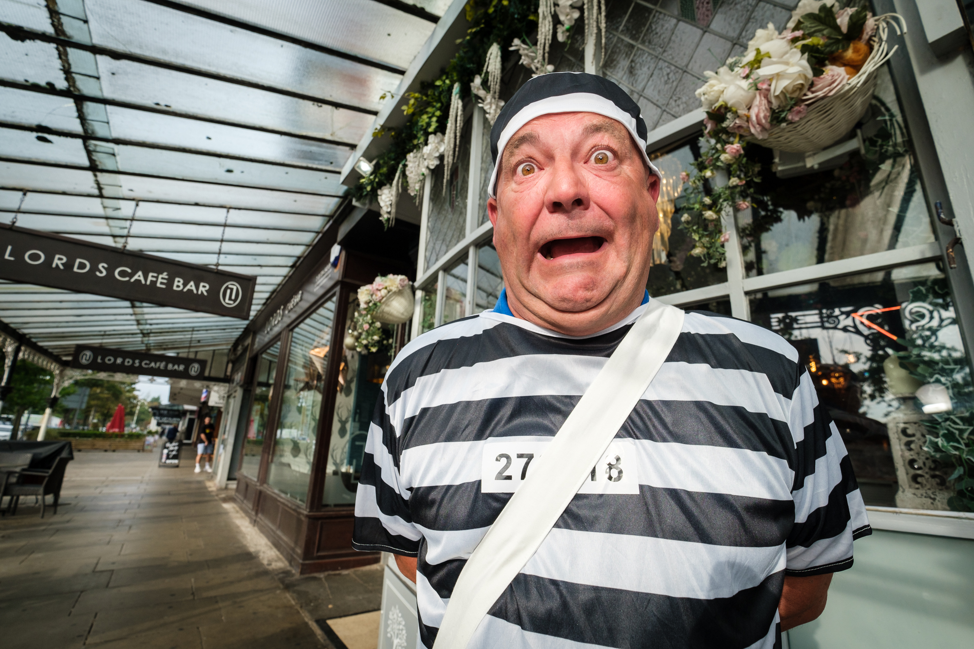 Rob Smallman takes part in the Jail and Bail fundraiser, organised by Stand Up For Southport and Queenscourt Hospice, outside the House Of Ivy on Lord Street in Southport. Photo by Dave Brown Photography