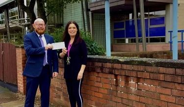 Mick White, Southport Branch Leader of Skipton Building Society is pictured presenting the cheque to Janine Hyland, Chief Executive of Parenting 2000