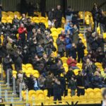 Southport FC supporters rose to give their applause to Life President Sam Shrouder in the 78th minute of the game against Farsley Celtic