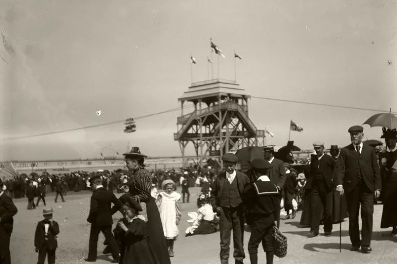People on Southport Promenade, with the sky ride in the background. Part of the Unseen Southport exhibition displayed at The Atkinson in Southport in 2014. Photo copyright The Atkinson