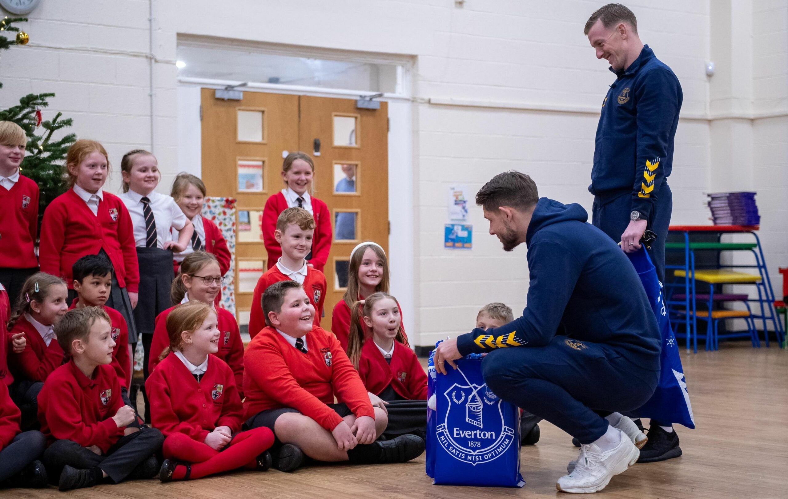 Thomas Ralphs, a pupil at Marshside Primary School in Southport, got an early Christmas treat when two of his Everton FC heroes surprised him midway through a school carol rehearsal. Photo by Everton FC