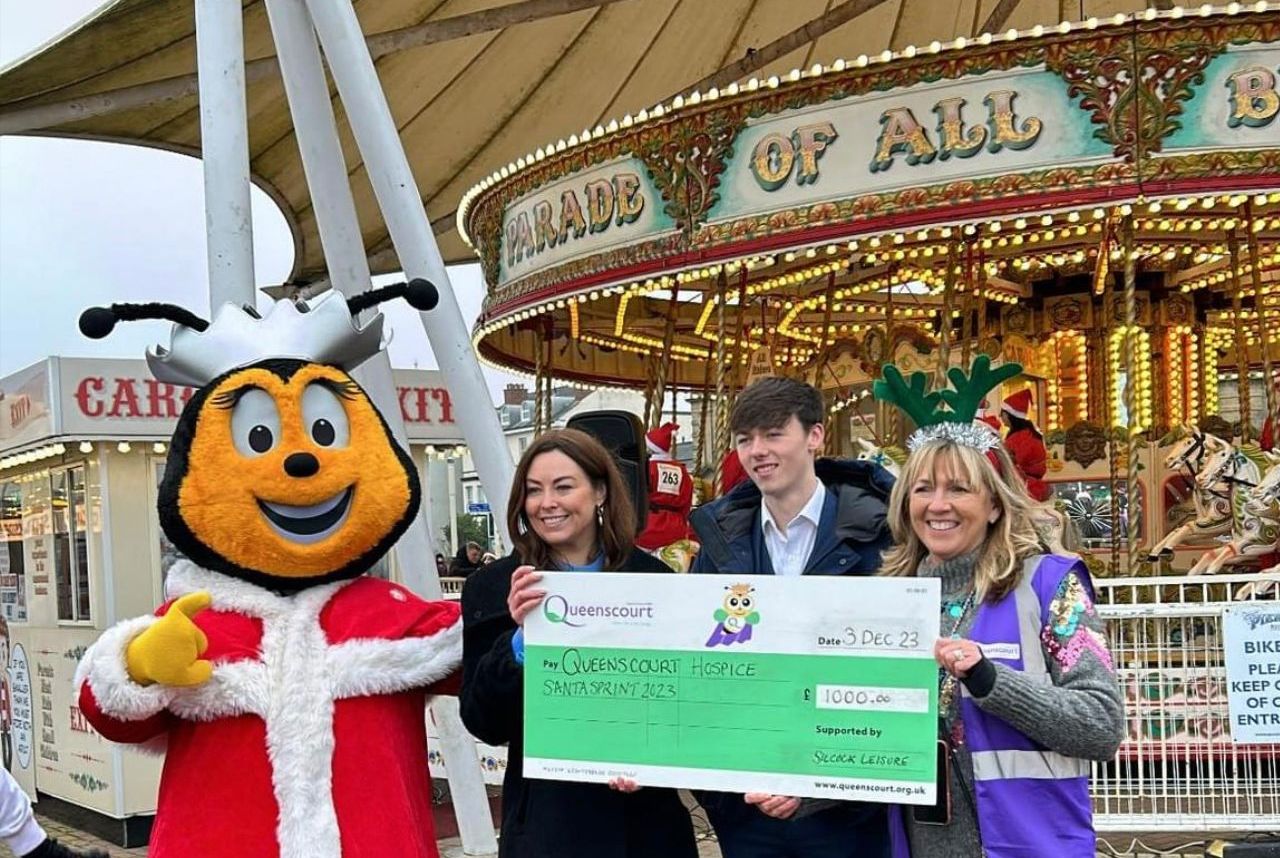 Hundreds of runners took part in the 2023 Southport Santa Sprint for Queenscourt Hospice. Silcocks Operations Manager Serena Silcock-Prince presented a £1,000 sponsorship cheque to Queenscourt Hospice. Photo by Andrew Brown Stand Up For Southport