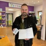 Alfie Boe signed a Derian mug and notepad while visiting the hospice