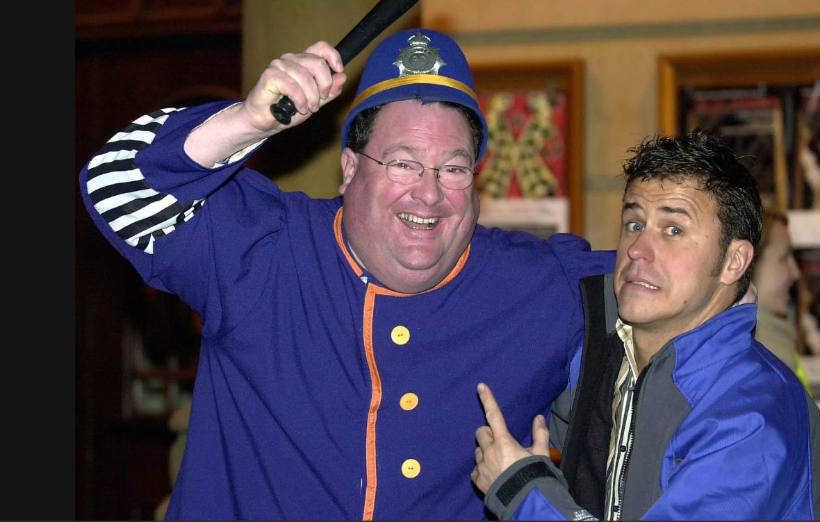 John Cooper (left) with Craig Phillips in pantomime
