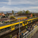 A Merseyrail train welcomes race goers at Aintree Train Station during the Grand National. Photo by Merseyrail