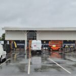 The new McDonald's unit surrounded by gates and vans