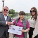 Herbert Silcock (left) and Serena Silcock-Prince (right) present a £1,000 cheque to Brenda Porter (centre) to support the 2024 Ainsdale Show