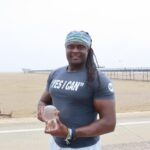 Inspirational speaker, author and tennis player Sam Jalloh at Southport Beach. Photo by Andrew Brown Stand Up For Southport