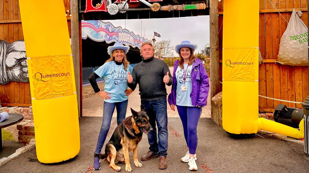 Walkers take part in the 2024 Star Trekk night walk to raise money for Queenscourt Hospice. Southport Pleasureland CEO Norman Wallis (centre) with Dianne Gillespie (left) and Liz Hartley (right) from Queenscorut Hospice