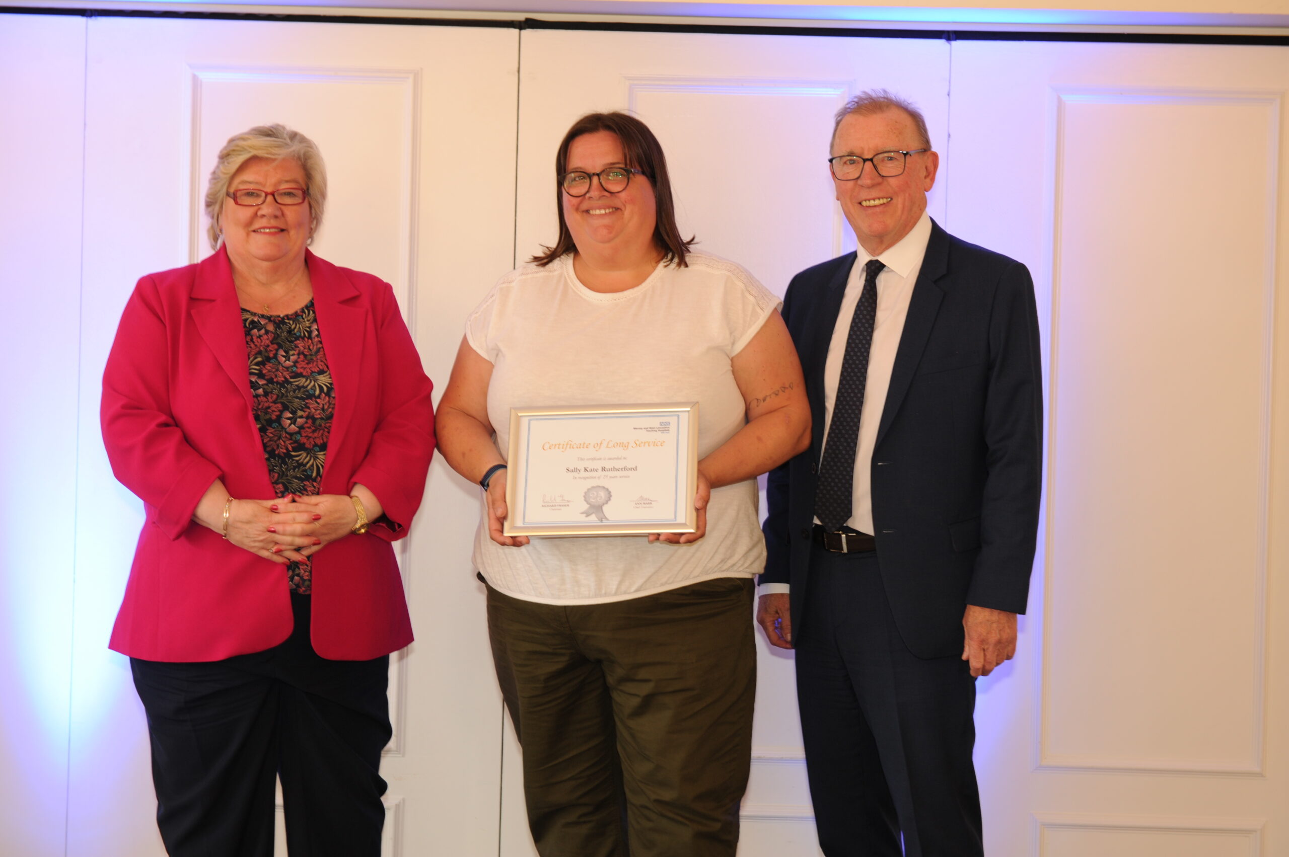 Sally Rutherford-Lees receives her long service certificate from Chief Executive Ann Marr and Chairman, Richard Fraser