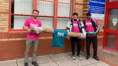 NHS fundraisers walk 26 miles with 30kg log between four hospitals to support dementia patients