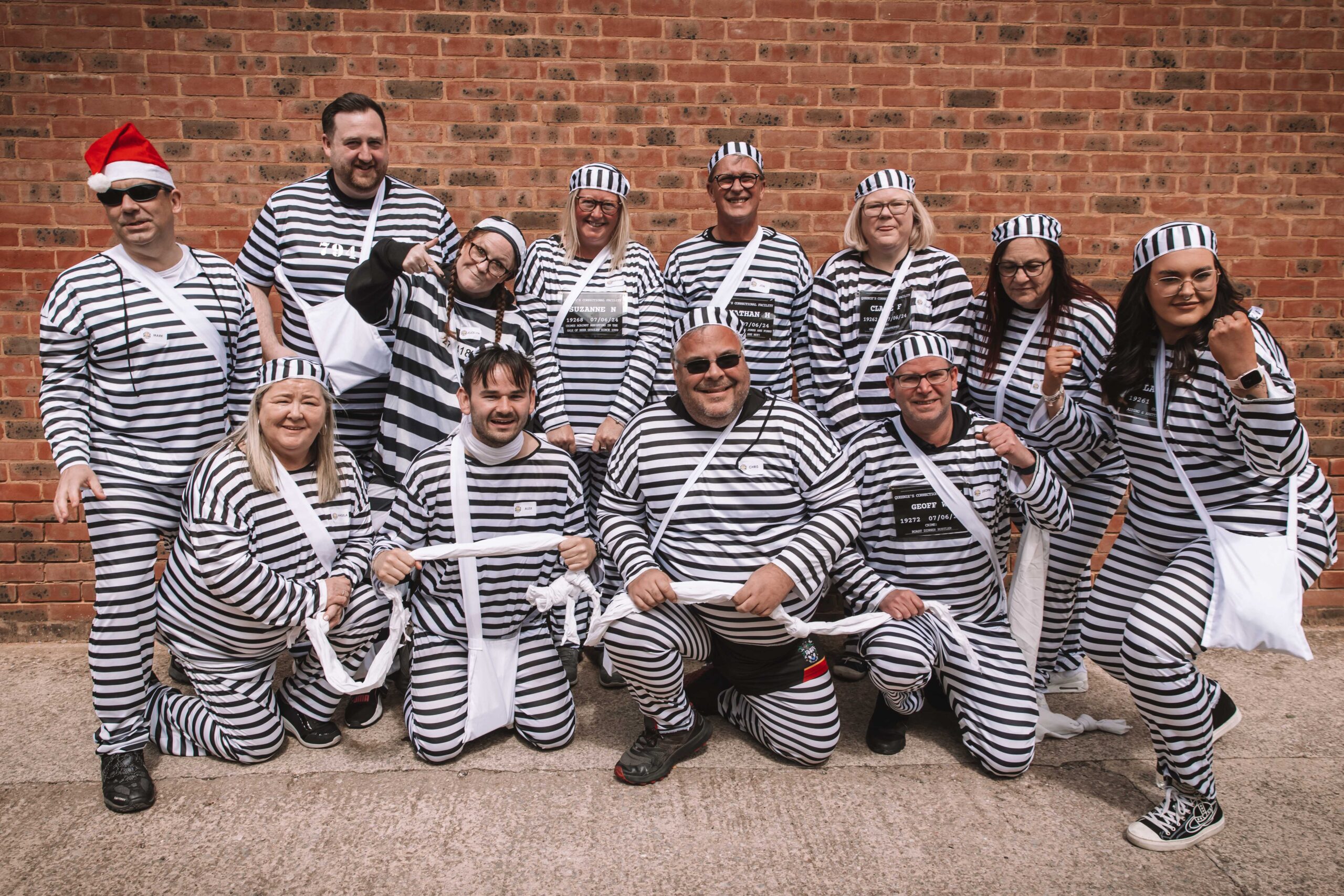 Twelve people have completed a bold escape from the cells at Southport Police Station in the annual Jail and Bail fundraiser for Queenscourt Hospice. Inmates at Southport Police Station 