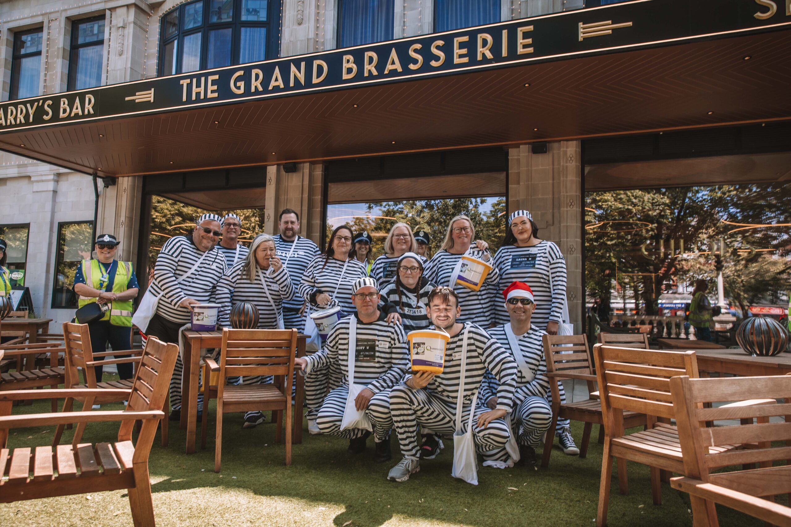Twelve people have completed a bold escape from the cells at Southport Police Station in the annual Jail and Bail fundraiser for Queenscourt Hospice. Inmates at The Grand on Lord Street in Southport  Photo by Zack Downey of ZED Productions