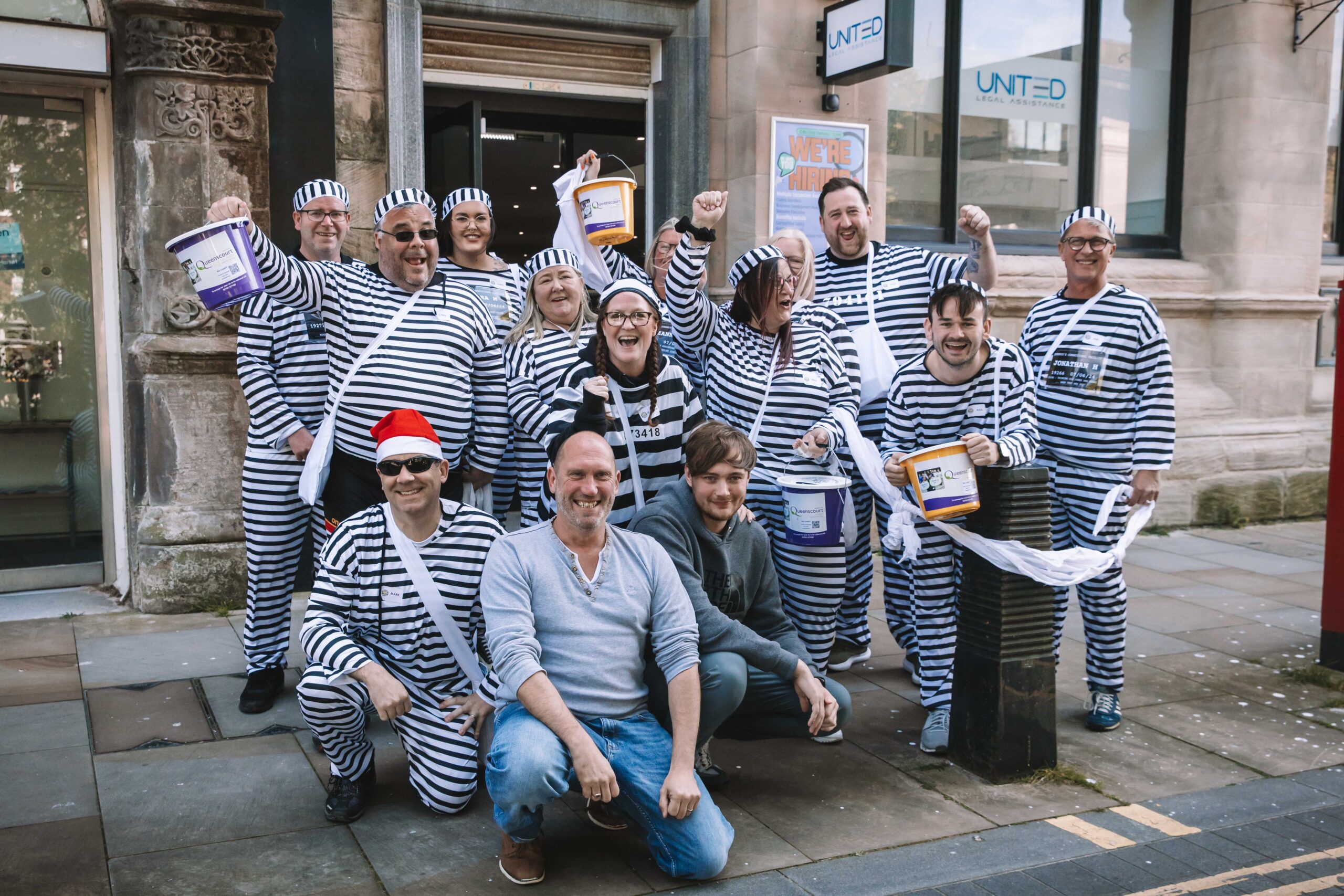 Twelve people have completed a bold escape from the cells at Southport Police Station in the annual Jail and Bail fundraiser for Queenscourt Hospice. Inmates at United Legal Assistance on Lord Street in Southport 