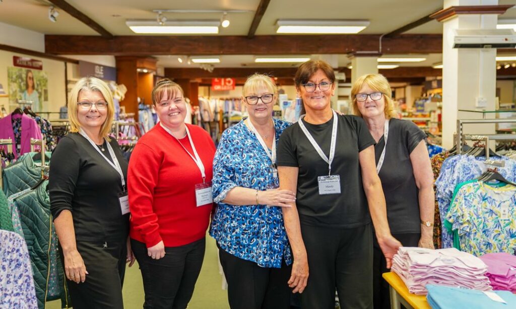 Edinburgh Woollen Mill on Lord Street in Southport. Lesley Mayo (centre) and her team. Photo by Bertie Cunningham Southport BID