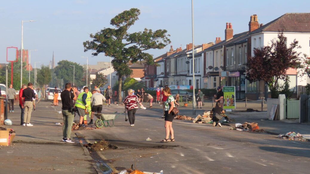 People clean up after the riot in the Sussex Road and Hart Street area in Southport. Photo by Andrew Brown Stand Up For Southport