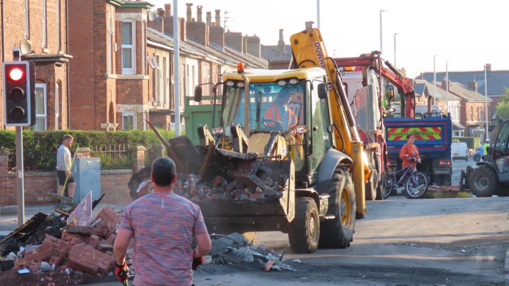 People clean up after the riot in Southport. Photo by Andrew Brown Stand Up For Southport