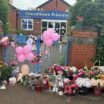 Tributes left outside Churchtown Primary School in Southport after three girls died in a tragedy on Hart Street