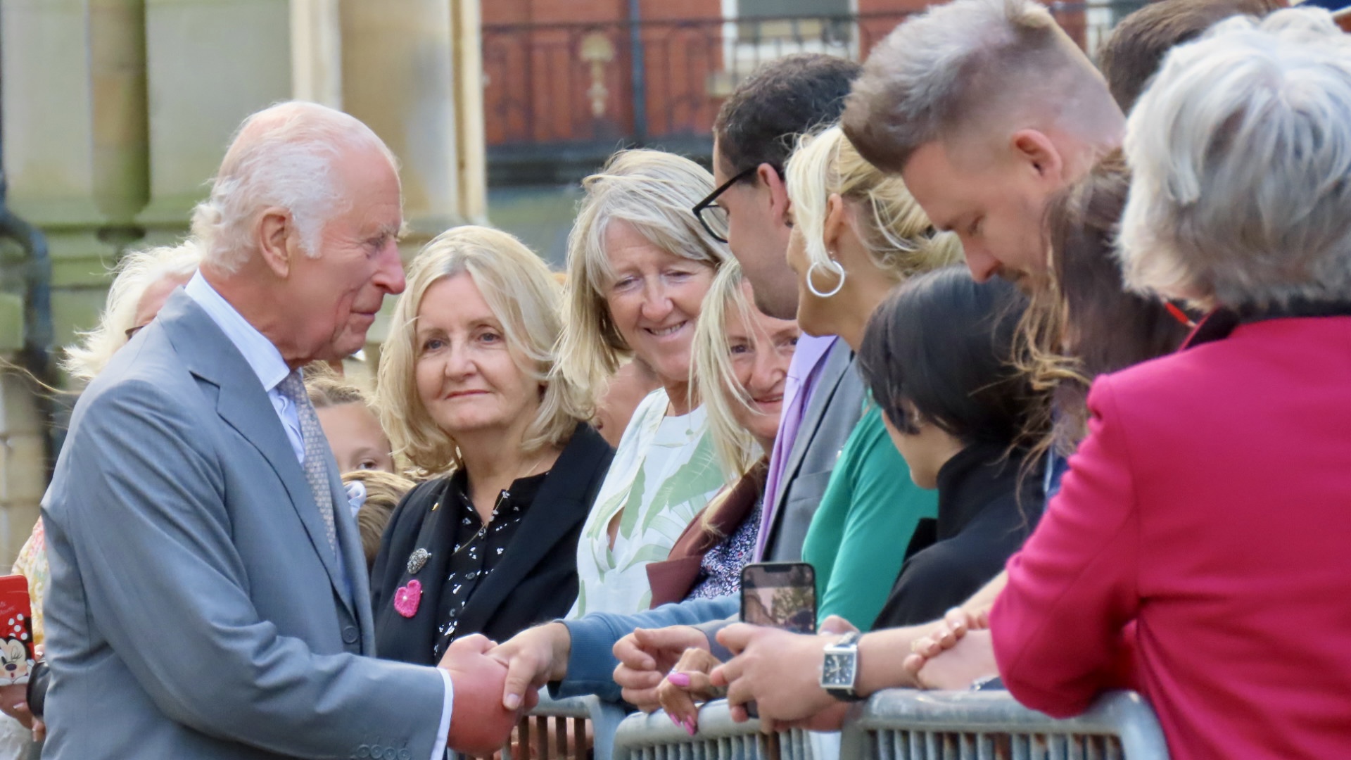 King Charles enjoys a royal visit in Southport. Photo by Andrew Brown Stand Up For Southport