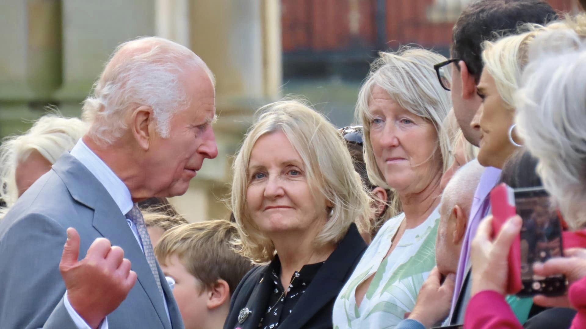 King Charles enjoys a royal visit in Southport. Photo by Andrew Brown Stand Up For Southport