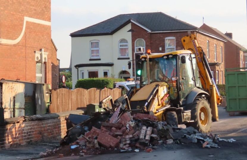 People clean up after the riot in Southport. Photo by Andrew Brown Stand Up For Southport