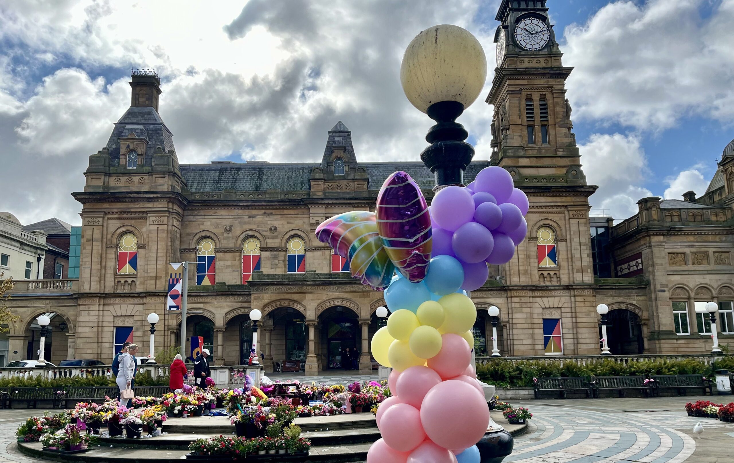 Tributes in the Town Hall Gardens in Southport. Photo by Andrew Brown Stand Up For Southport