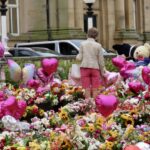 Families leave tributes to the three girls who died in Southport in the Town Hall Gardens in Southport. Photo by Andrew Brown Stand Up For Southport