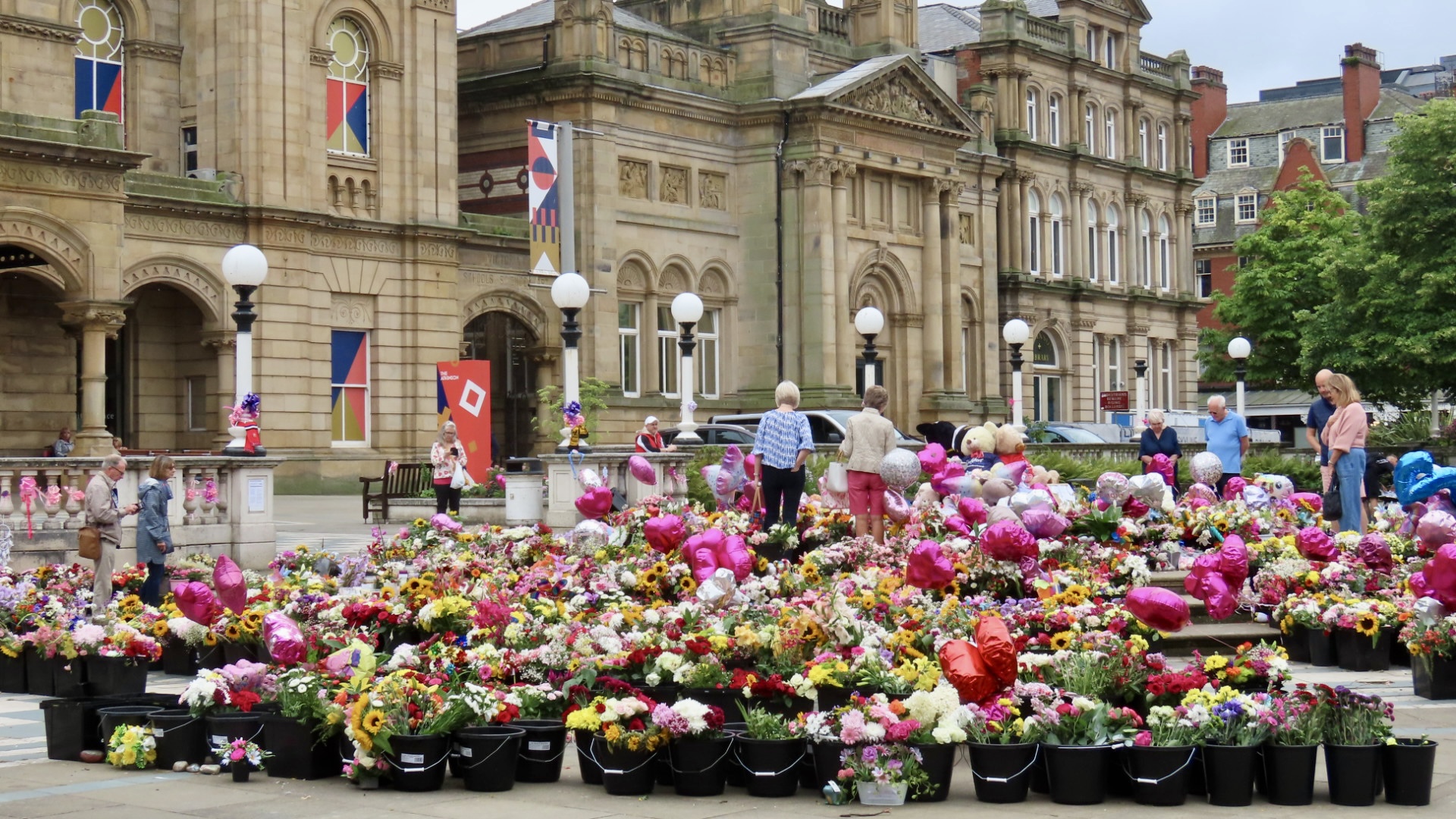 Families leave tributes to the three girls who died in Southport in the Town Hall Gardens in Southport. Photo by Andrew Brown Stand Up For Southport