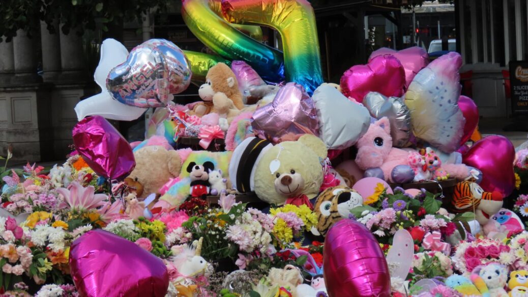 Tributes to the three girls who died at the Town Hall Gardens in Southport. Photo by Andrew Brown Stand Up For Southport