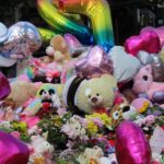 Tributes to the three girls who died at the Town Hall Gardens in Southport. Photo by Andrew Brown Stand Up For Southport