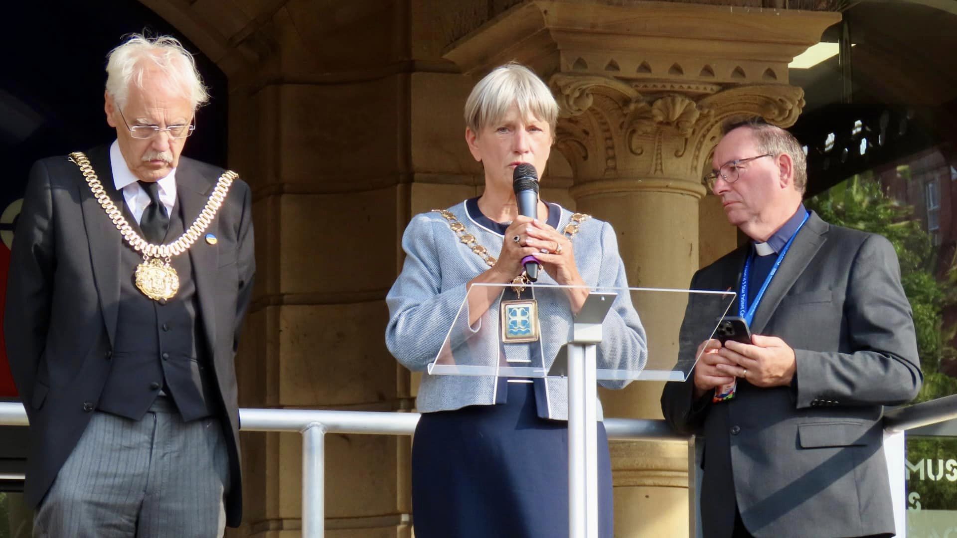 Crowds attend the vigil in the Town Hall gardens in Southport after the tragic deaths of three young girls at The Hart Space in Southport on 29th July 2024. Mayof of Sefton Cllr June Burns addresses the people attending. Photo by Andrew Brown Stand Up For Southport