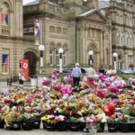 People lay tributes in the Town Hall Gardens in Southport after the Southport Tragedy. Photo by Andrew Brown Stand Up For Southport