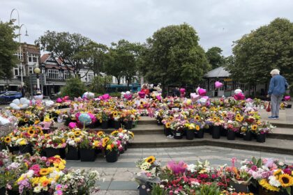 Tributes left in the Town Hall Gardens in Southport to the girls killed and injured in the tragedy at The Hart Space in Southport. Photo by Andrew Brown Stand Up For Southport