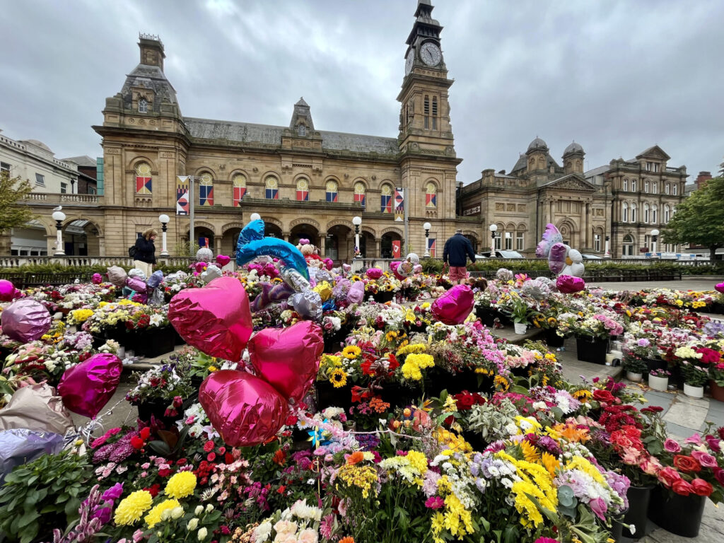 Thousands of tributes were set out in the Town Hall Gardens in Southport after the Southport tragedy. Photo by Andrew Brown Stand Up For Southport