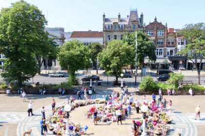 Tributes in the Town Hall Gardens in Southport after the Southport tragedy. Photo by Andrew Brown Stand Up For Southport