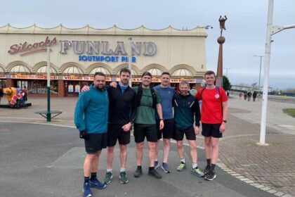 Alex Rigby and friends pictured during their training in Southport, They are pictured outside Silcock's Funland