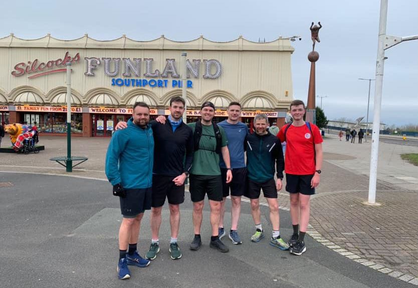 Alex Rigby and friends pictured during their training in Southport, They are pictured outside Silcock's Funland