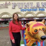 Silcock Leisure Group Operations Head Of Operations Serena Silcock-Prince with Jester the bear outside Silcock's Funland in Southport. Photo by Andrew Brown Stand Up For Southport