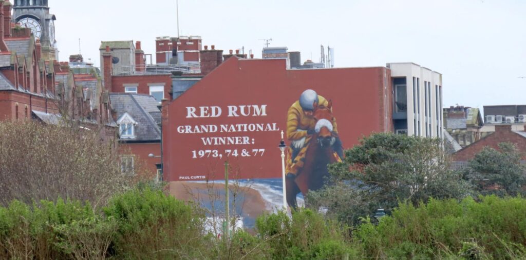 The Red Rum mural by Paul Curtis Artwork on the Promenade in Southport. Red Rum won the Grand National three times. Photo by Andrew Brown Stand Up For Southport