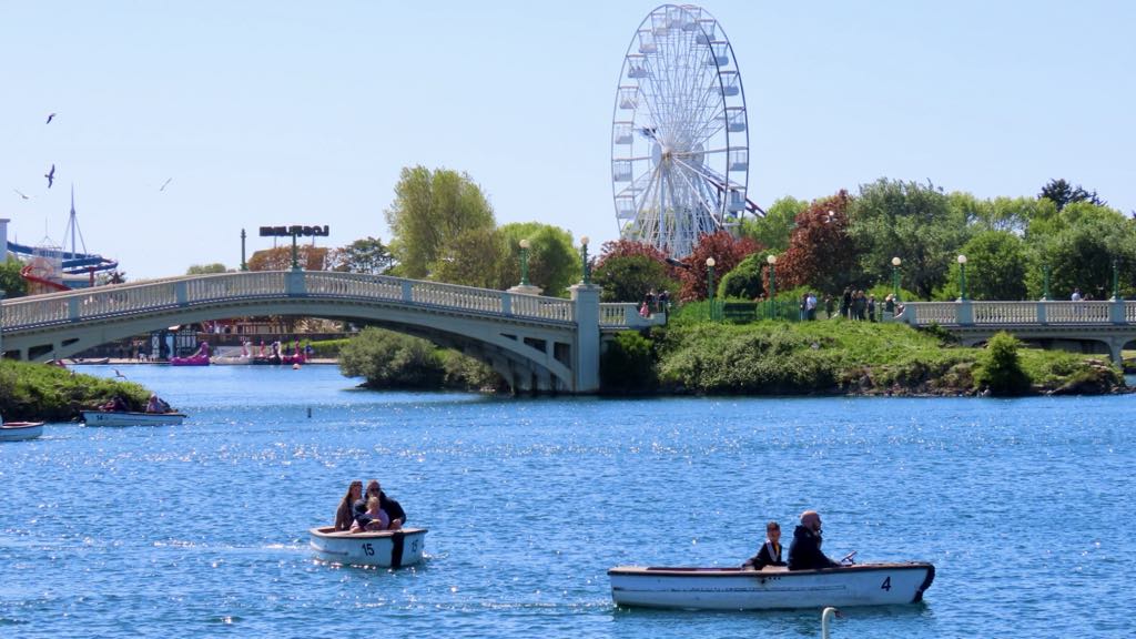 A scenic photo of families enjoying boat rides on the Marine Lake in Southport