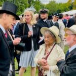 Prince Edward chatting with Kevin and Mary Dunne, the founders of the Stem Cell Scousers, at a Garden Party at Buckingham Palace