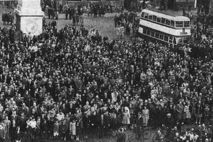 People in Southport celebrate VE Day on May 8, 1945. Crowds gather on Lord Street in Southport to await the King's Speech on VE Day 1945.