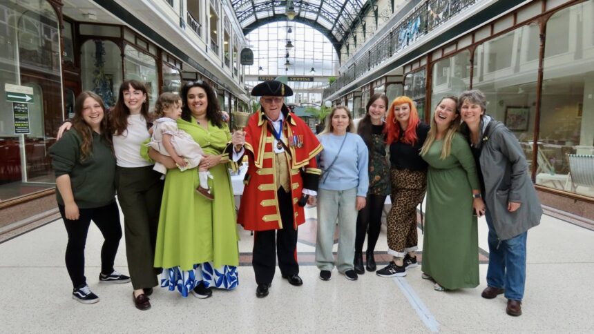 People enjoy the Great Big Green Lunch at Wayfarers Arcade on Lord Street in Southport. Photo by Andrew Brown Stand Up For Southport